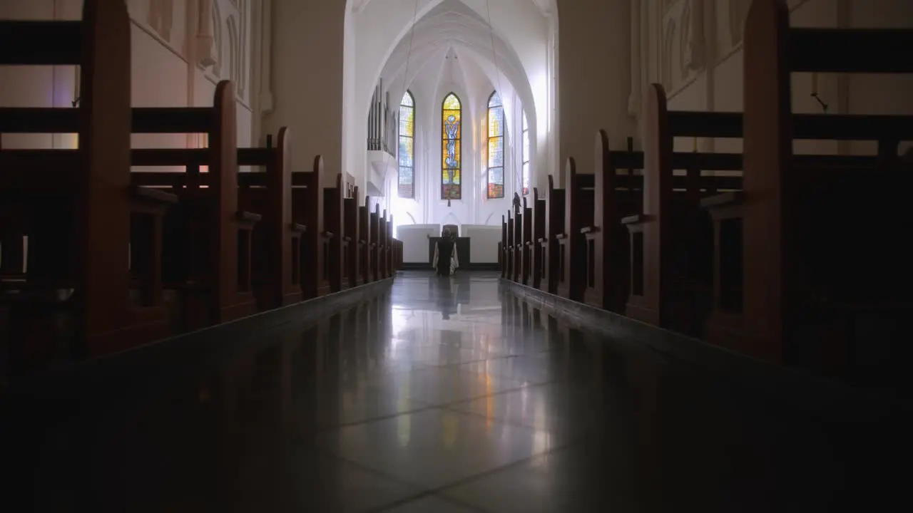 Holy path in church empty seats monk sitting in front of altar