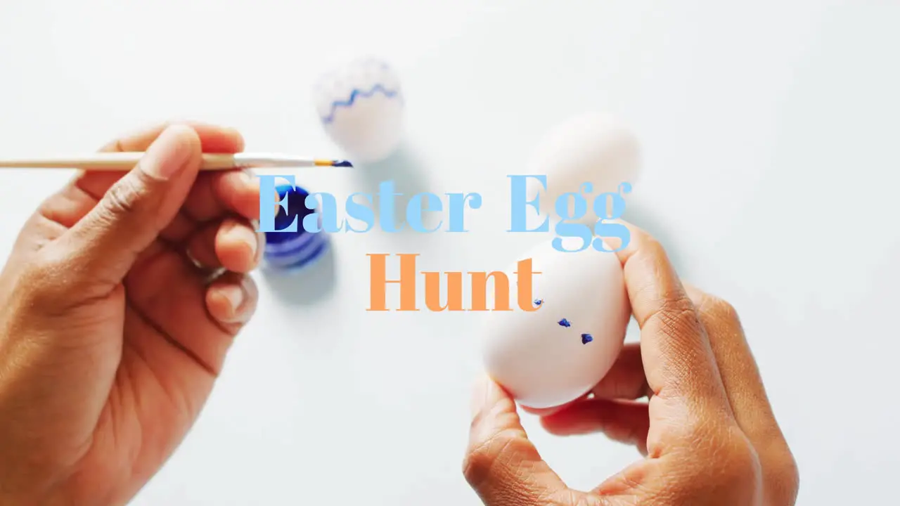 Animation of easter egg hunt text over biracial woman painting easter eggs on white background