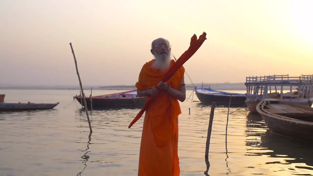 Man Praying Over River Ganges