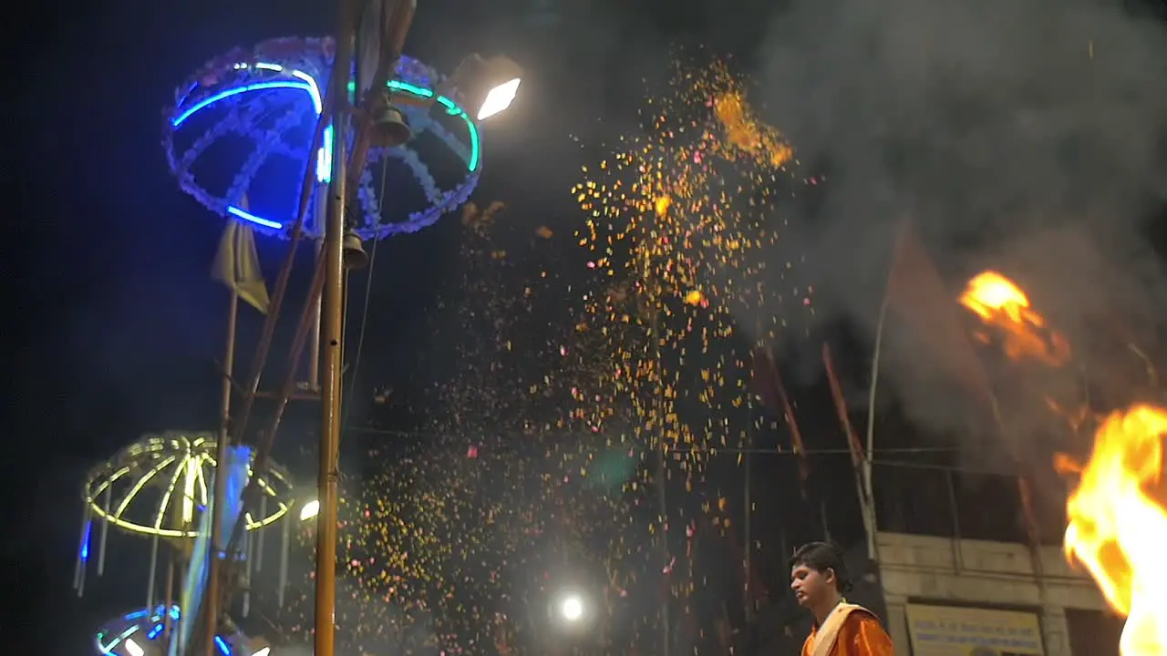 Indian Men Throw Marigold Petals Into the Air