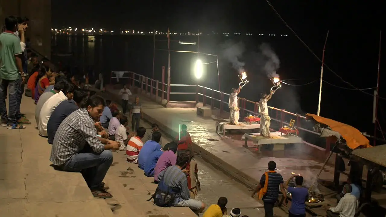 Reveal Shot of Men Performing Fire Ceremony