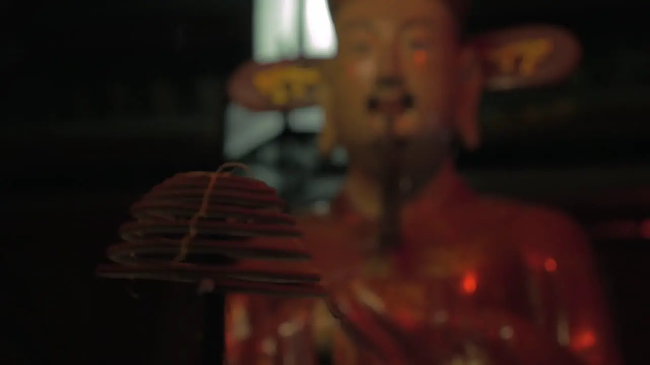 Incense and statue in Hanoi Temple of Confucius Vietnam