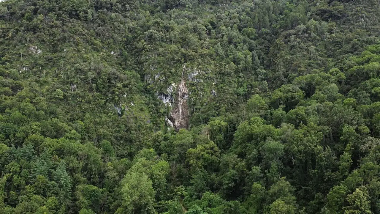 drone on the forest seeing the waterfall of froda in Castelveccana Italy