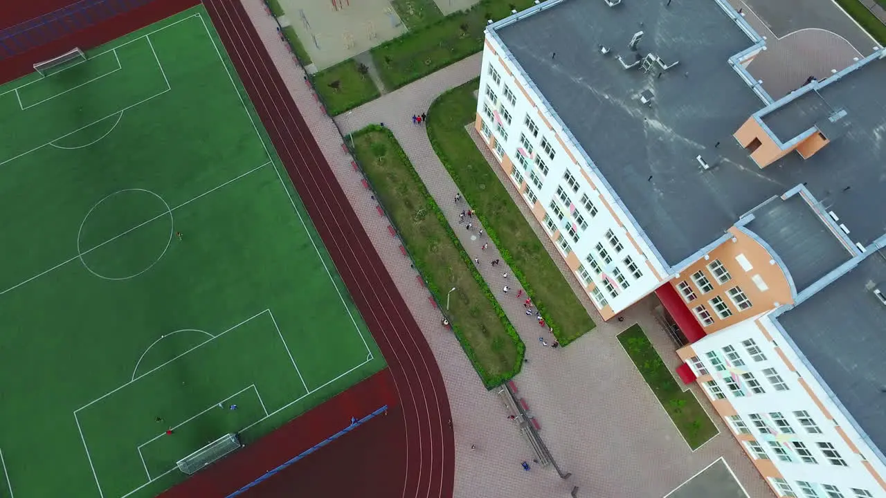 Football field and stadium in school yard Aerial view sport ground in courtyard