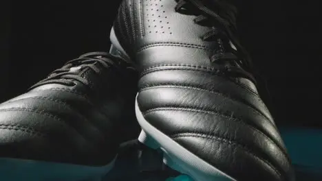 Studio Still Life Shot Of Football Soccer Boots Against Black Background 2