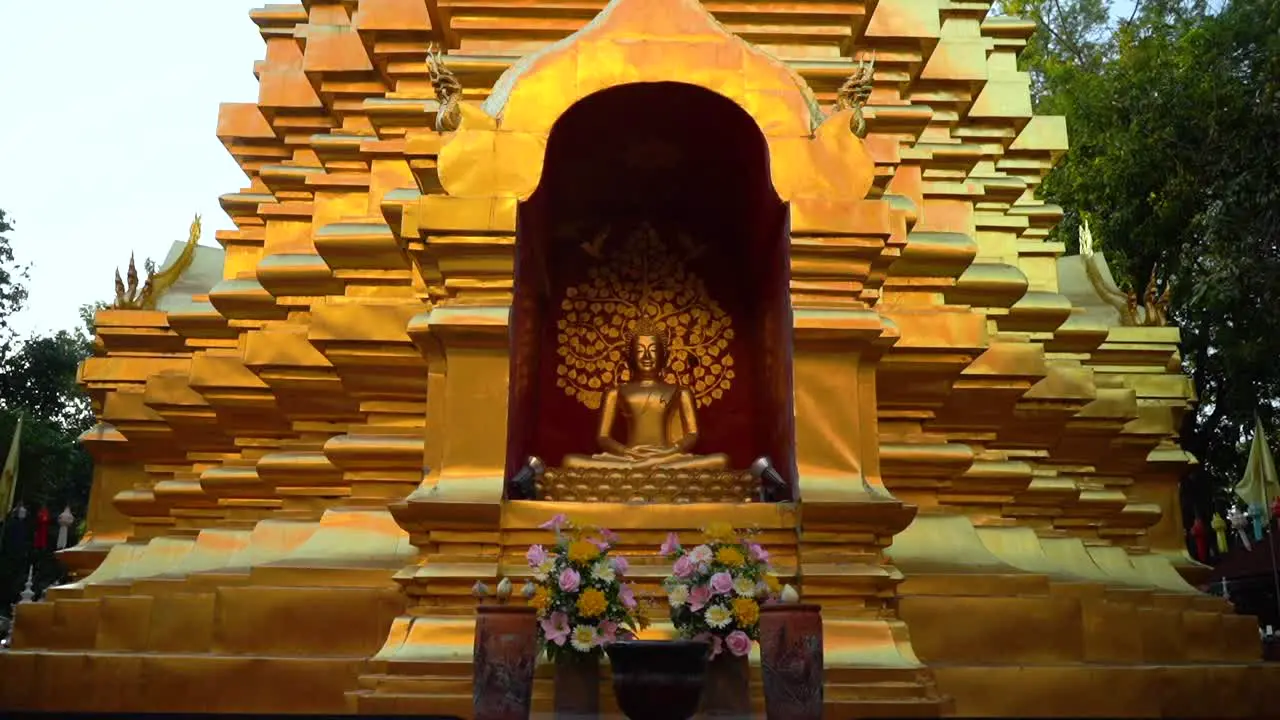 Gliding in a Golden Buddha Statue at a Buddhist Temple in Chiang Mai Thailand