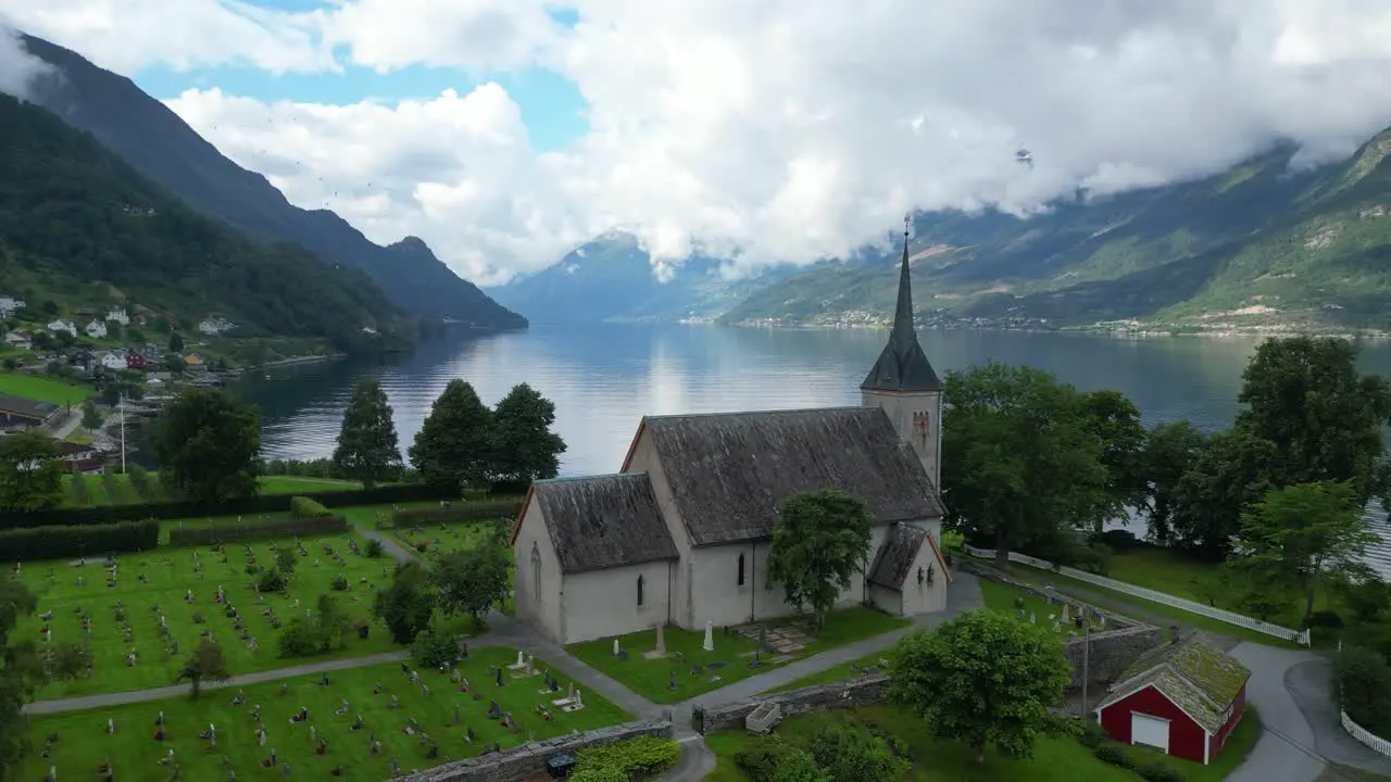 Ullensvang Church and Headstones in Hardangerfjord Vestland Norway Aerial Circling