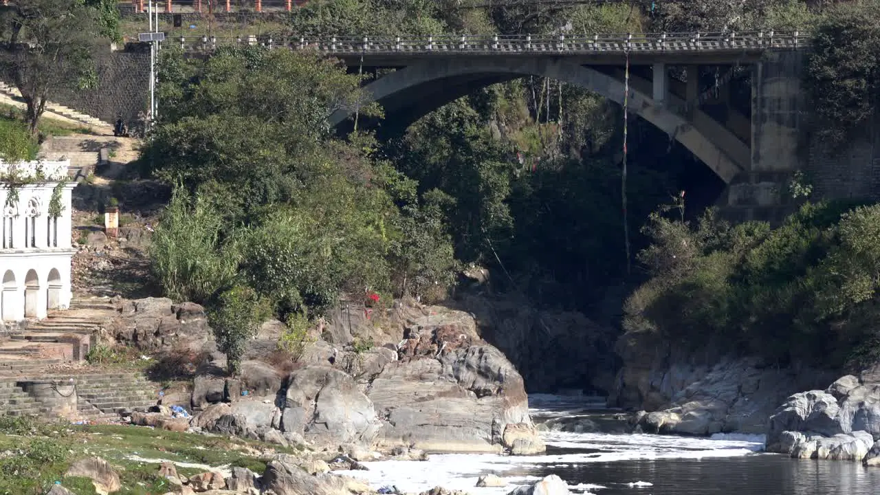 A bridge spanning the Bagmati River as it comes out of the Kathmandu Valley in Nepal