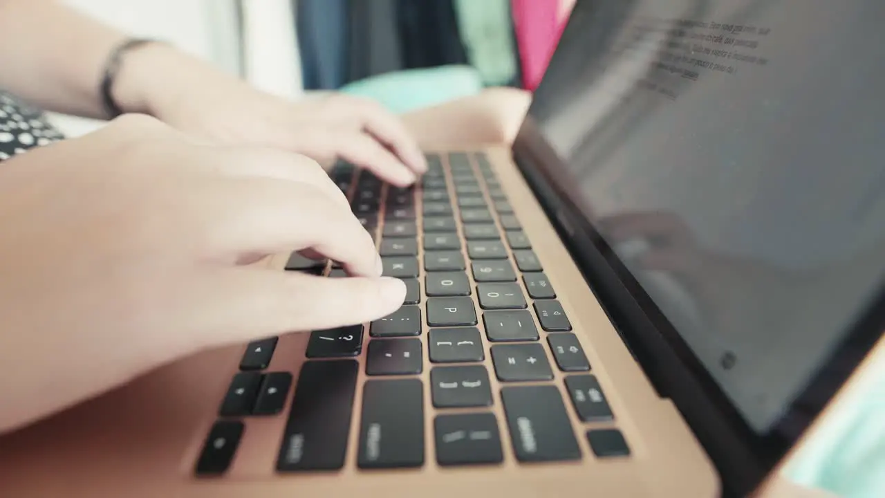 Closeup shot of a hands on keyword typing on laptop