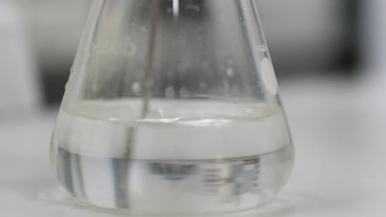 Mixing Chemicals In A Science Flask Experimental Water Purity Test