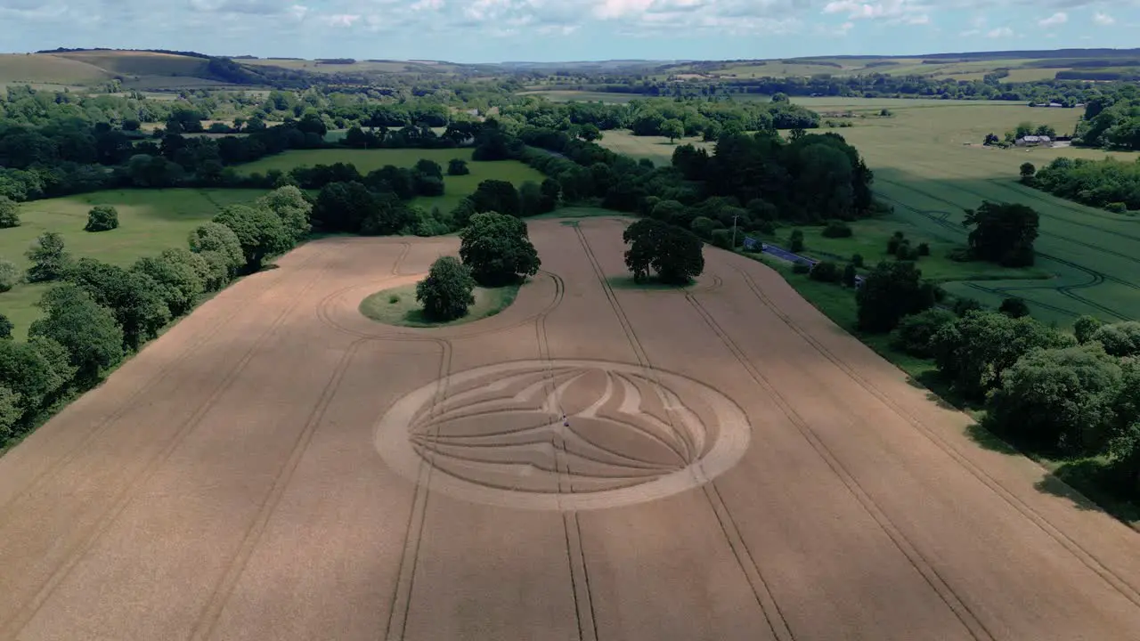 Warminster 2023 crop circle pattern on vast British farmland harvested wheat field aerial orbiting view