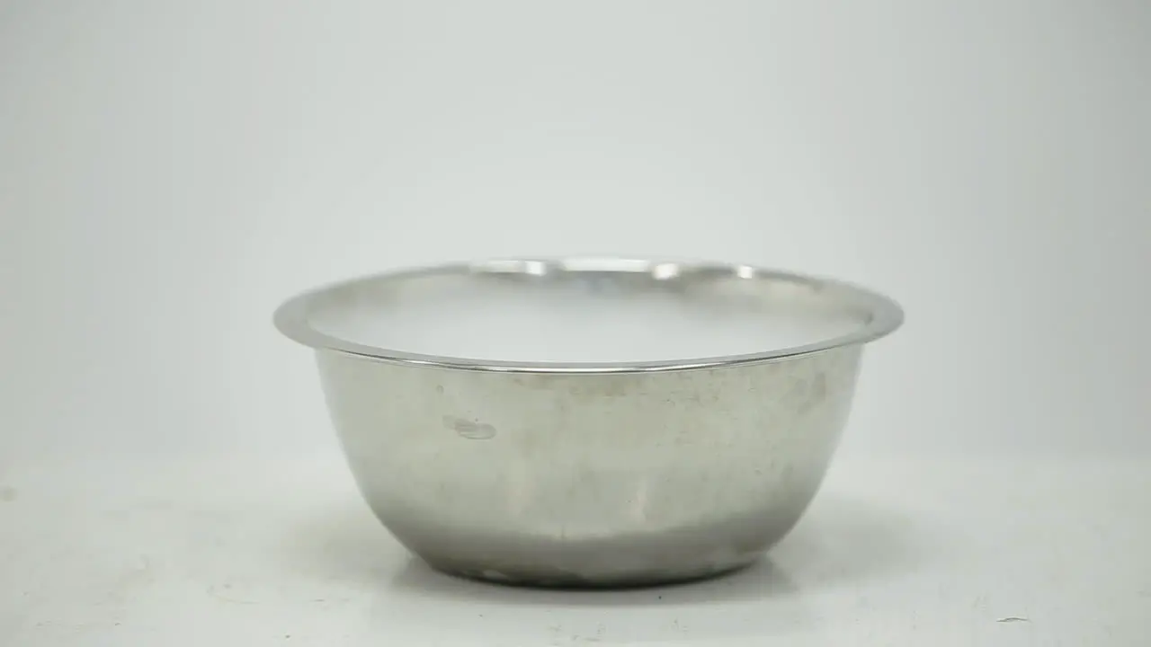 Water poured over dry ice in a bowl