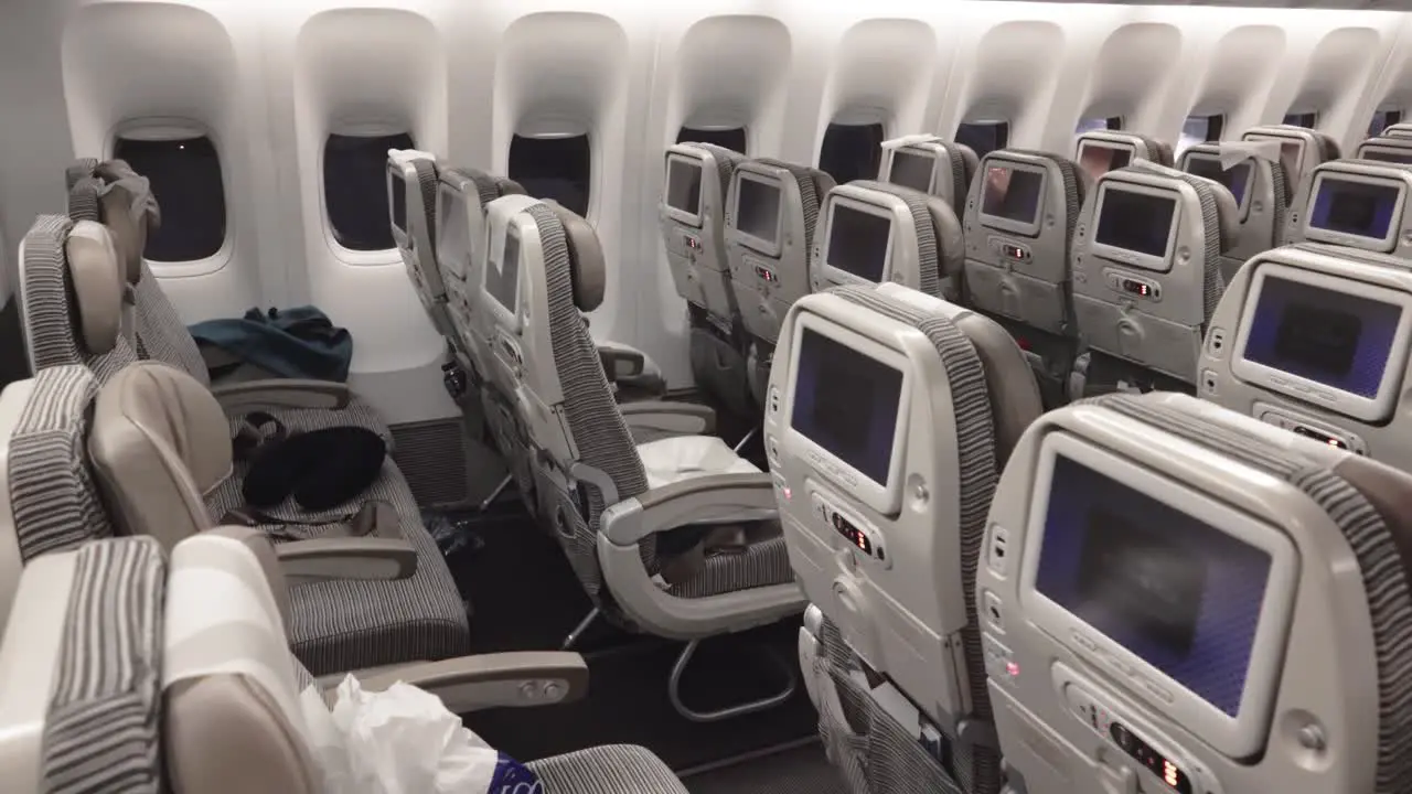 Commercial Airplane Cabin with empty rows of seat