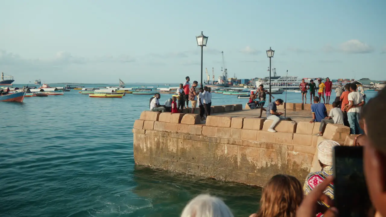 Youth performing a handstand dive in Zanzibar