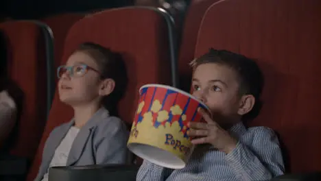 Children watching movies in cinema Movie entertainment for kids