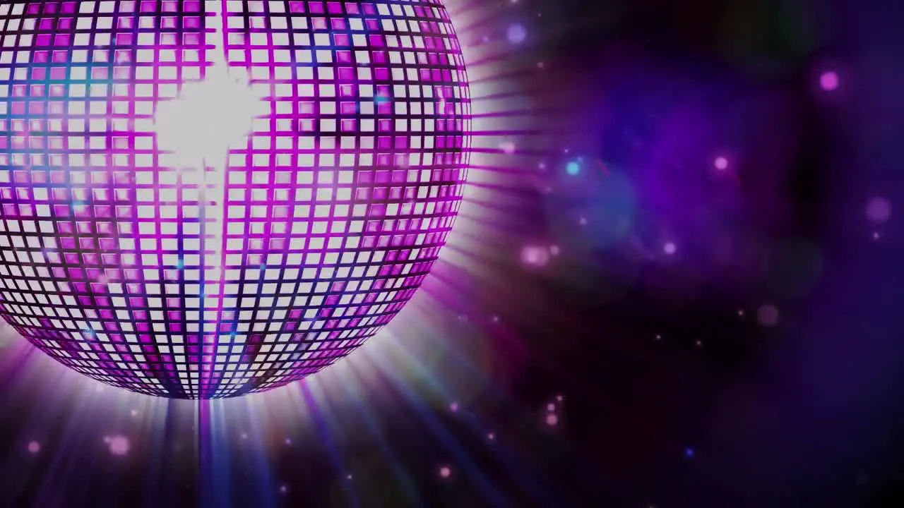 Animation of disco mirror ball spinning on black background