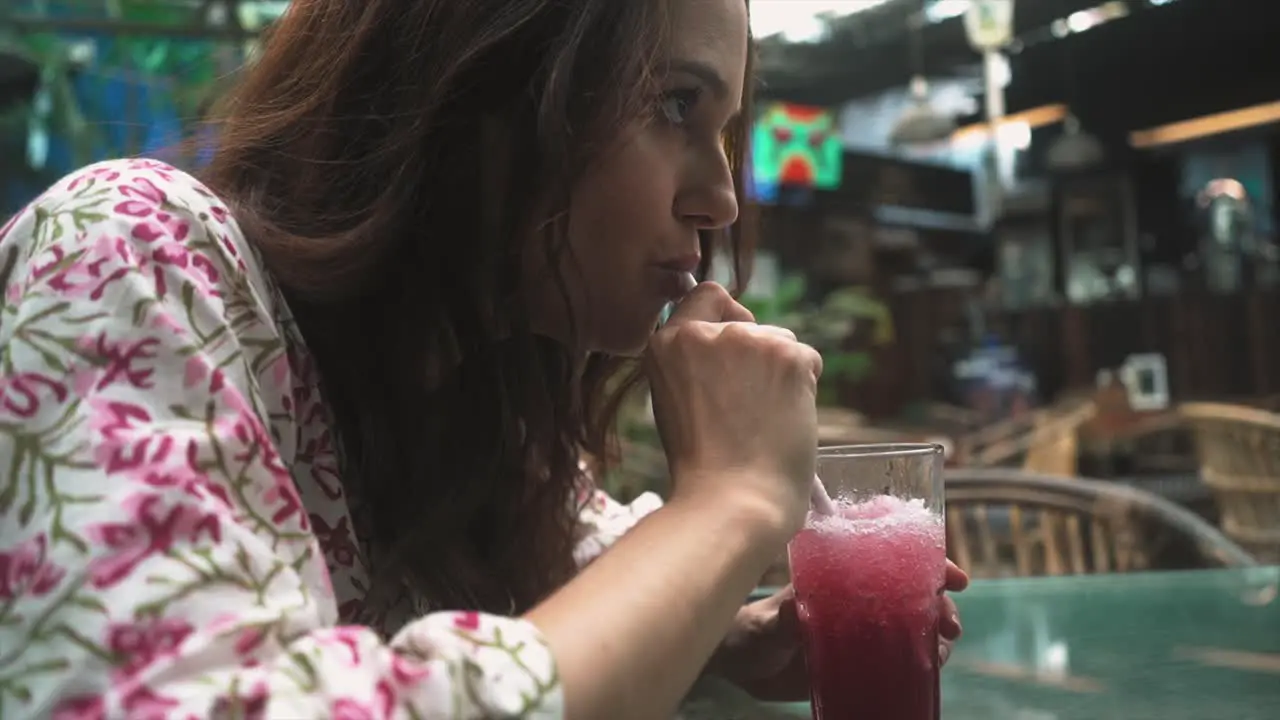 An Indian woman savoring a drink at a traditional Indian bar in Panaji Goa India on 31-08-2023