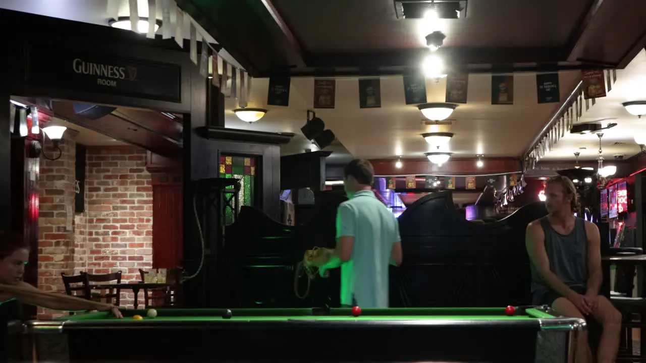 People playing Pool Billiards in a Bar at night in Australia