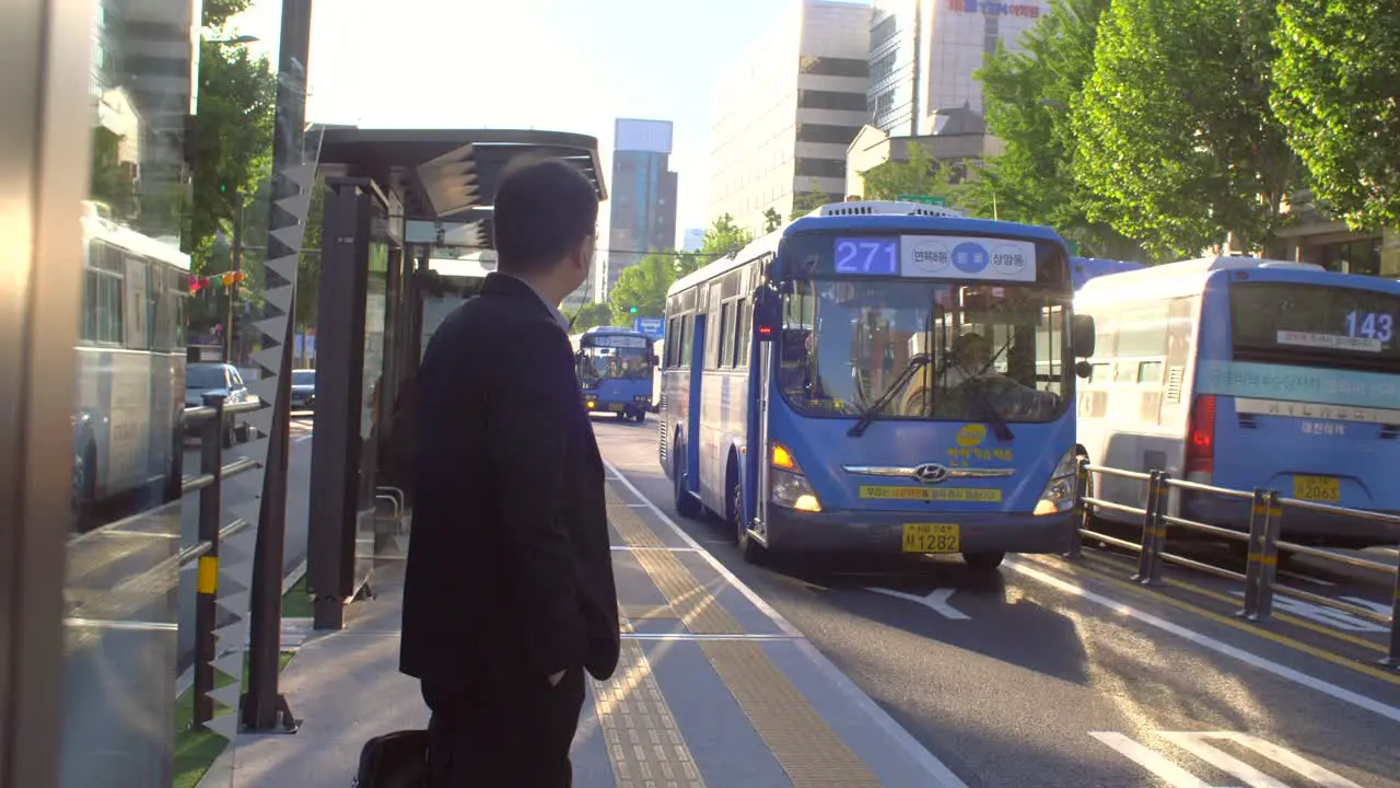 Commuter Waiting for Bus