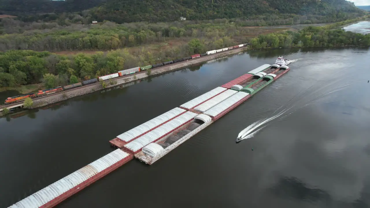 Approaching Lansing Iowa a towboat pushing barges north on the Mississippi River