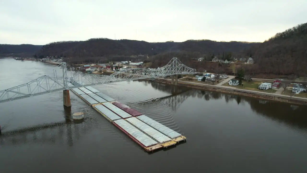 Below the Black Hawk Bridge at Lansing Iowa a towboat pushes barges north on the Mississippi River