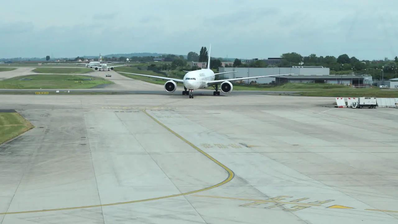 Air France jet taxiing on tarmac after landing heading towards arrival gate