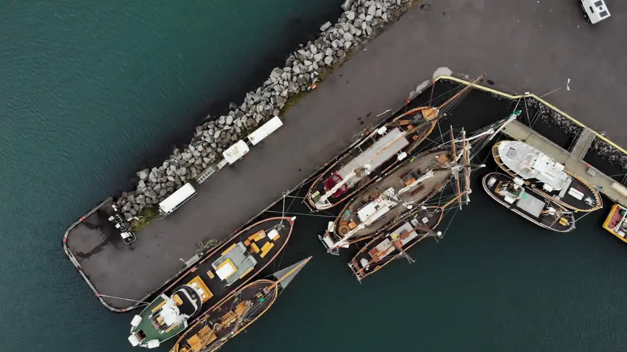 Top down aerial of of boats in the harbour of Seyðisfjörður a small town in Iceland