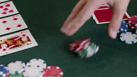 High Angle Shot of Poker Player Checking Cards Before Betting 