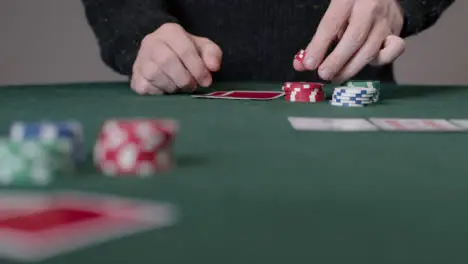 Long Shot of Poker Player Thinking and Placing Bet