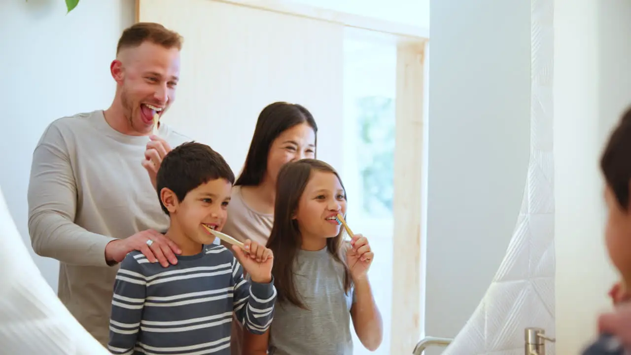 Happy family brushing teeth