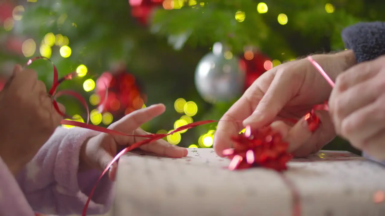 Closeup of Hands Unwrapping Present Part 2