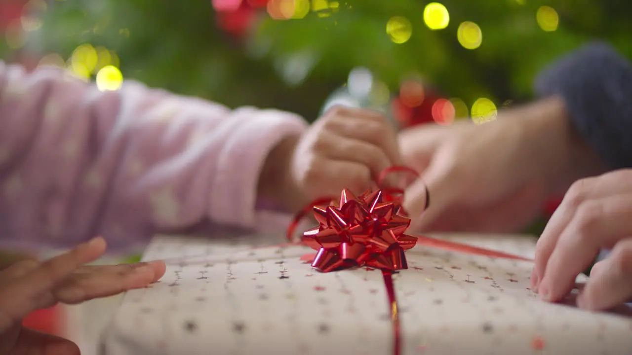 Closeup of Hands Unwrapping Present Part 1