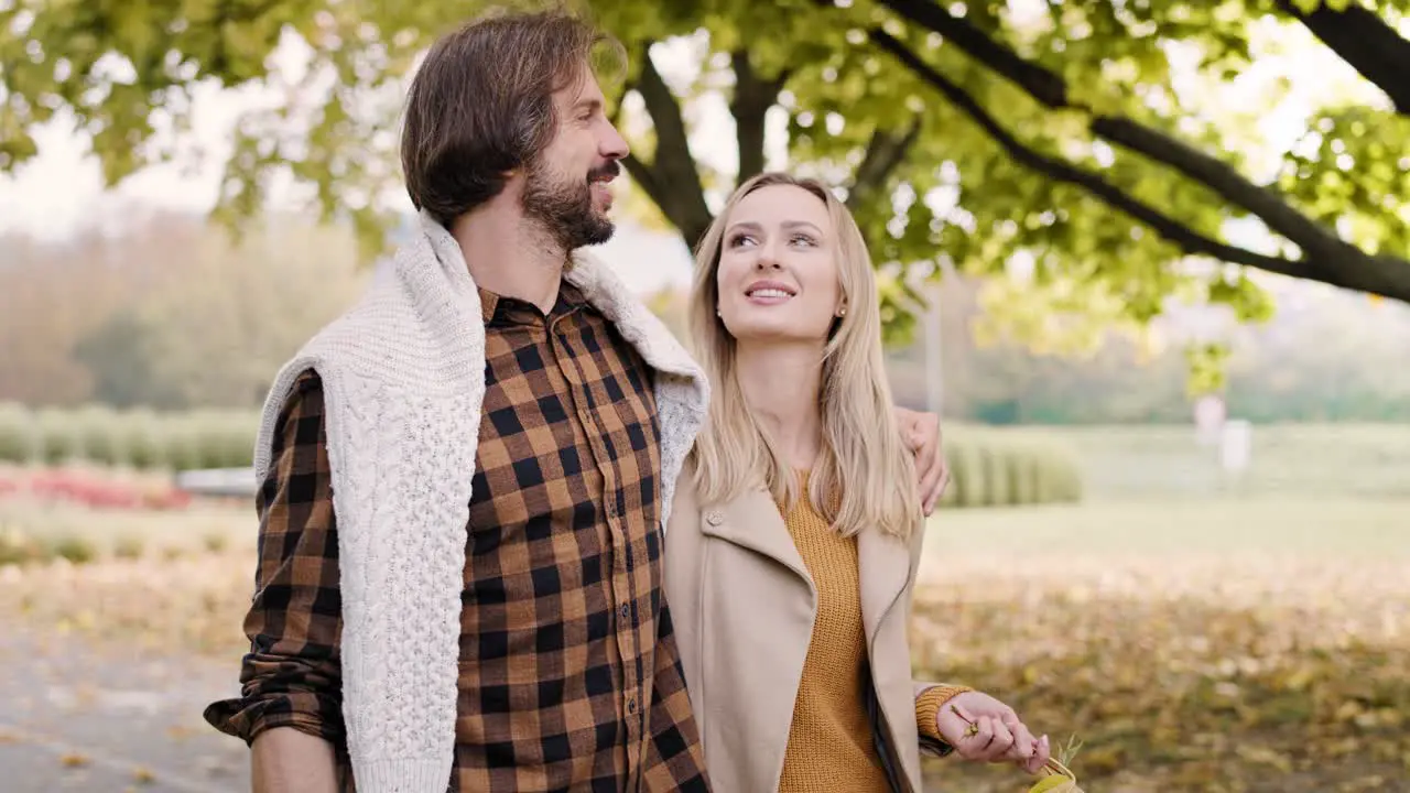 Loving couple during autumn walk in the park