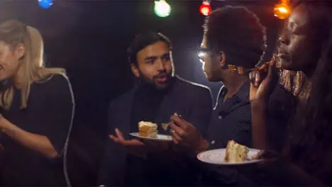 Woman Dances and Eats Cake