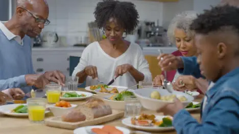 Family Begin Eating Evening Dinner Together 