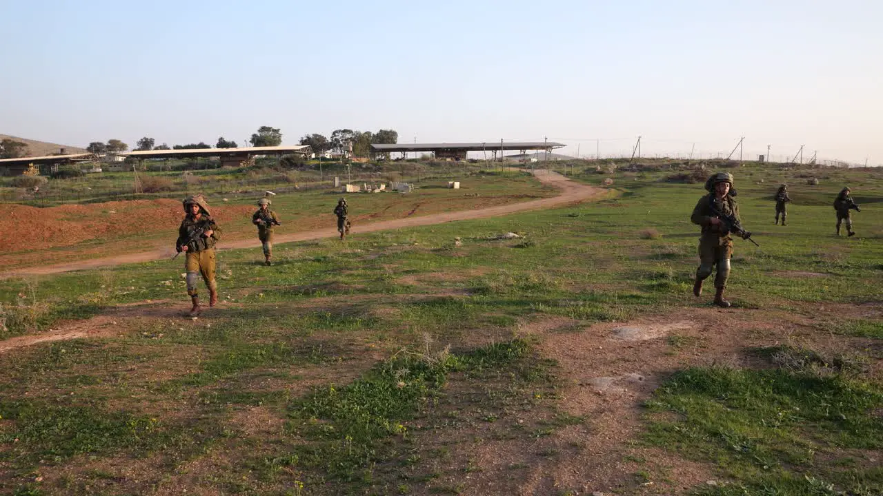 Soldiers finding a practice grenade in the battle field wide view