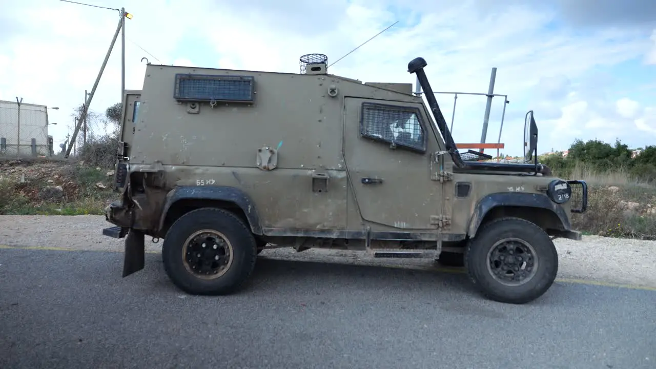 Young IDF Armed Soldiers in Uniform With Machine Guns Running and Get Inside Humvee Military Car and Depart on Mission