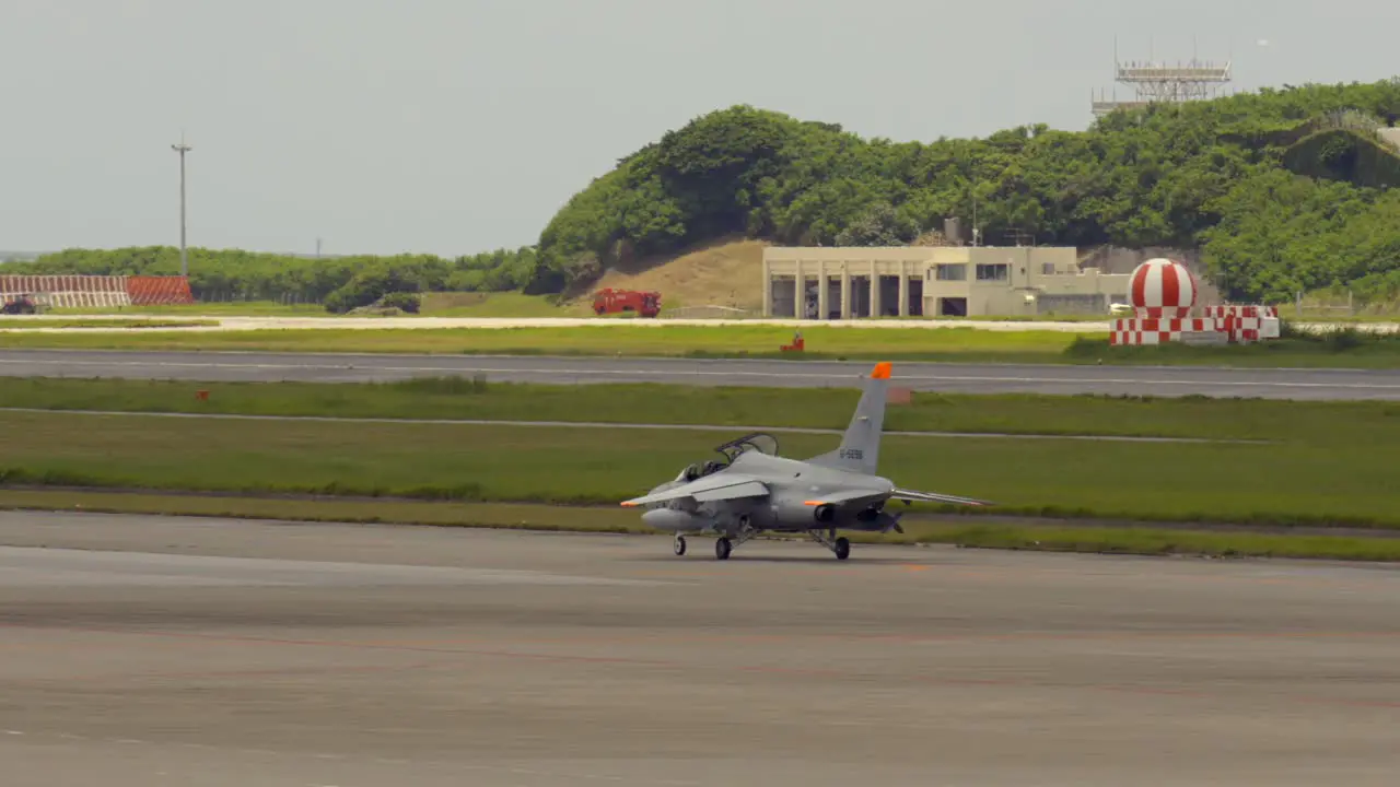 Open Military Jet on Landing track at Okinawa International Airport Naha Prefecture Japan Japanese America USA Air force Caza Jet