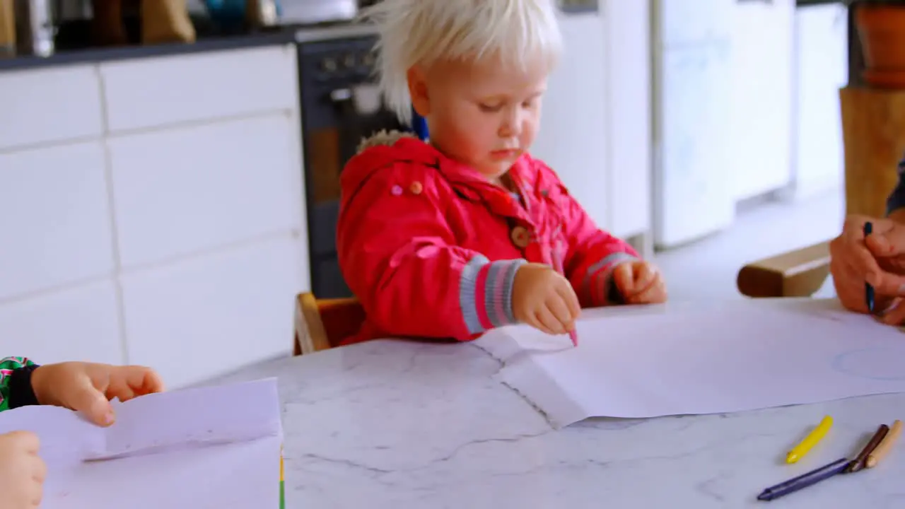 Father helping his daughter in drawing at home 4k