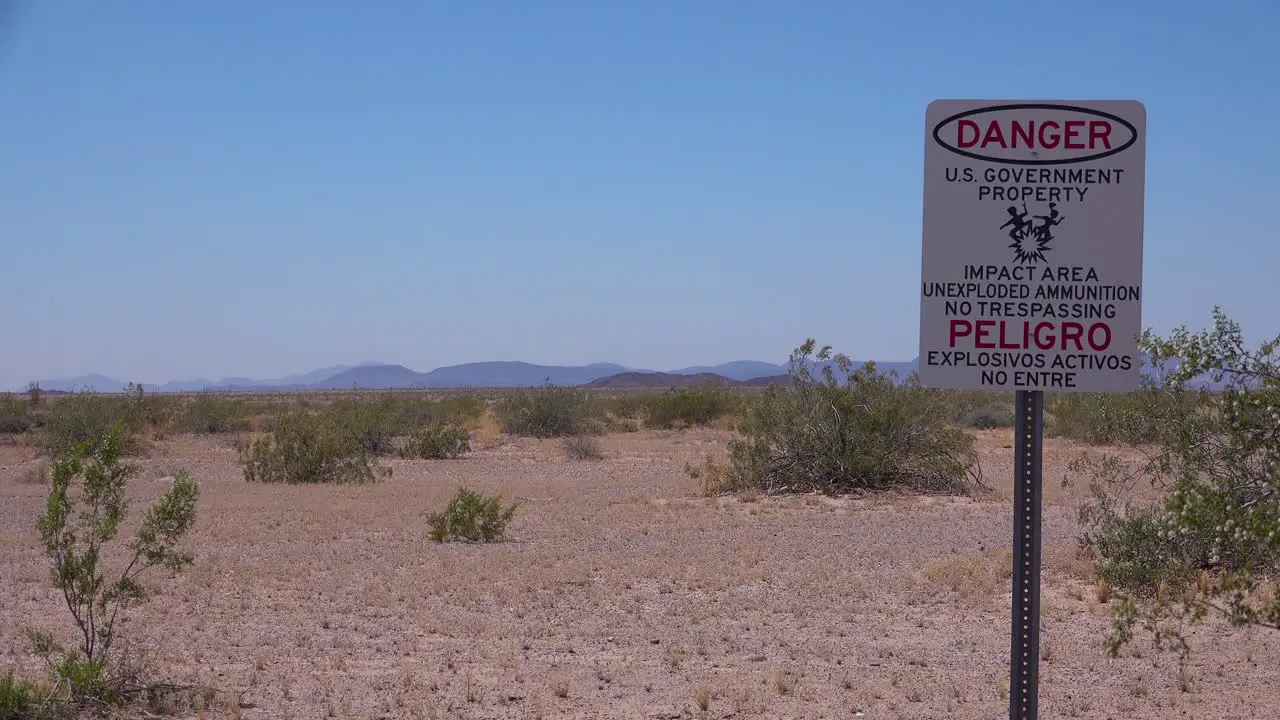 A sign in the Nevada desert near a military base warns of unexploded bombs and munitions