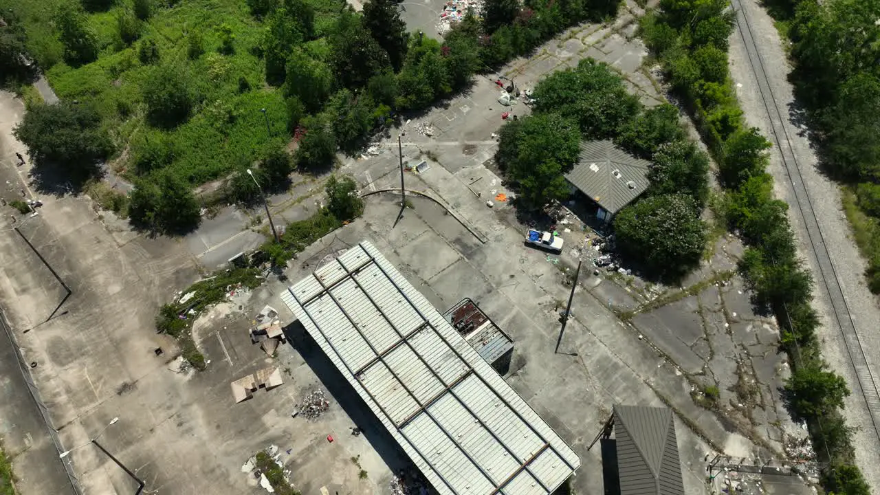 Aerial reveal of an abandoned military facility in New Orleans with the City of New Orleans in the background