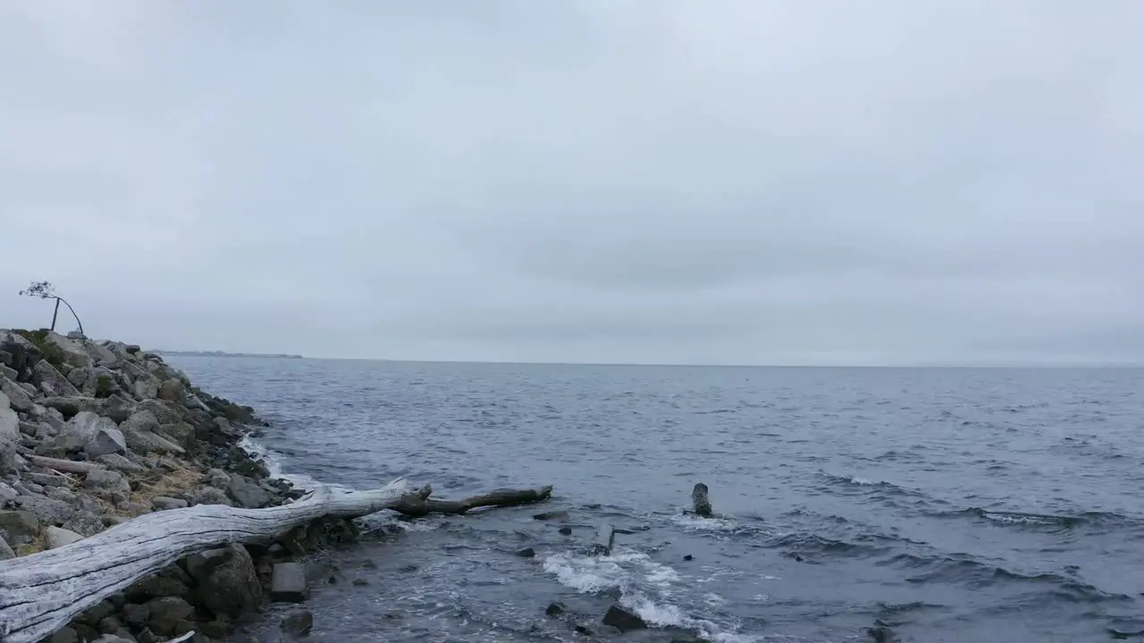 Rainy cloudy day over the misty foggy bay