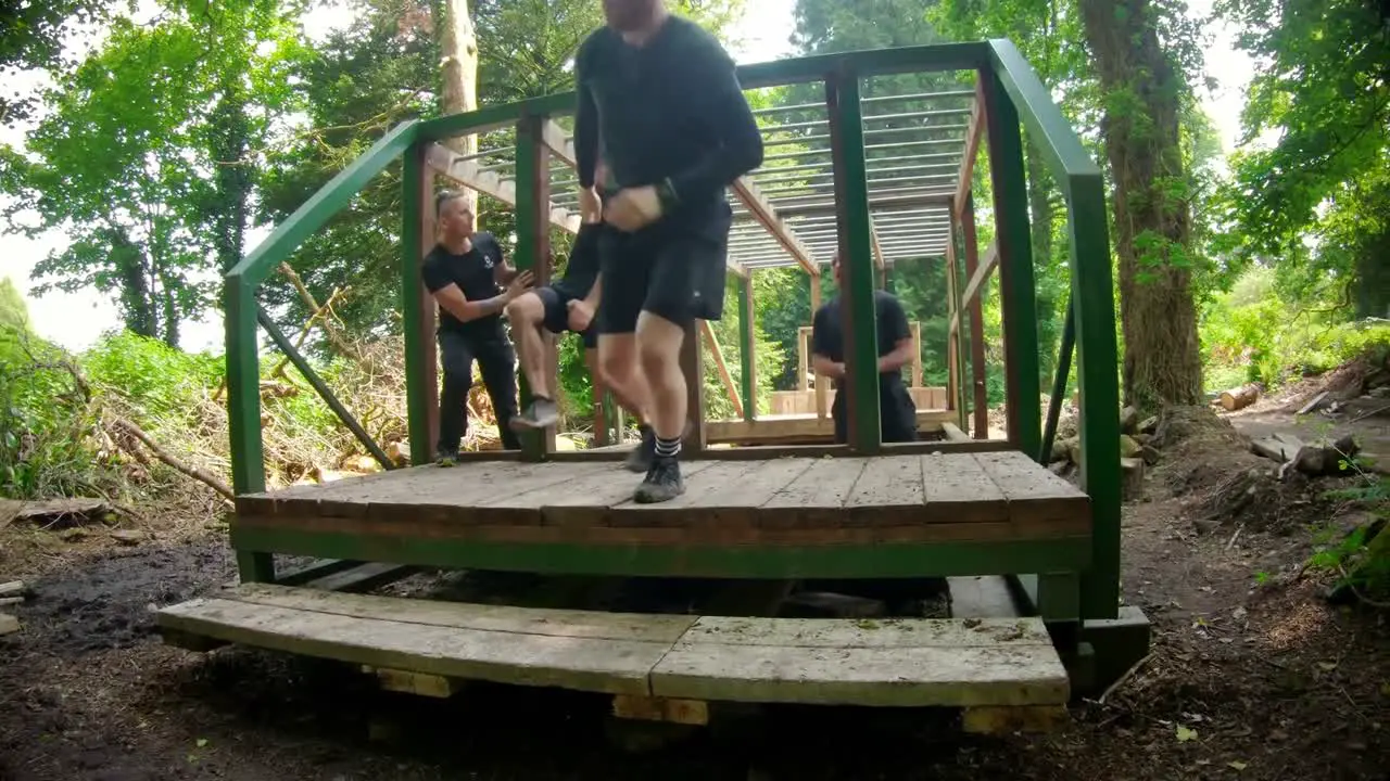 Fit man climbing monkey bars 4k