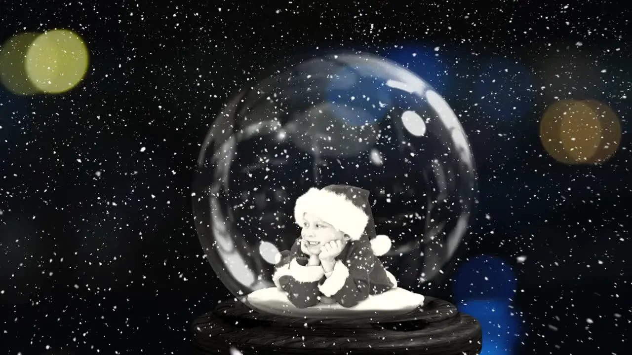 Animation of snow falling over christmas snow globe with santa claus