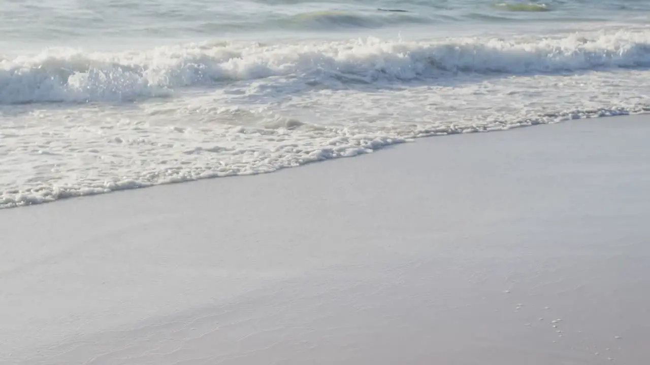 Video of calm sea waves and sand beach