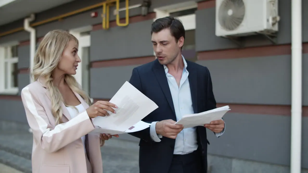 Closeup business couple discussing documents Partners enjoy success