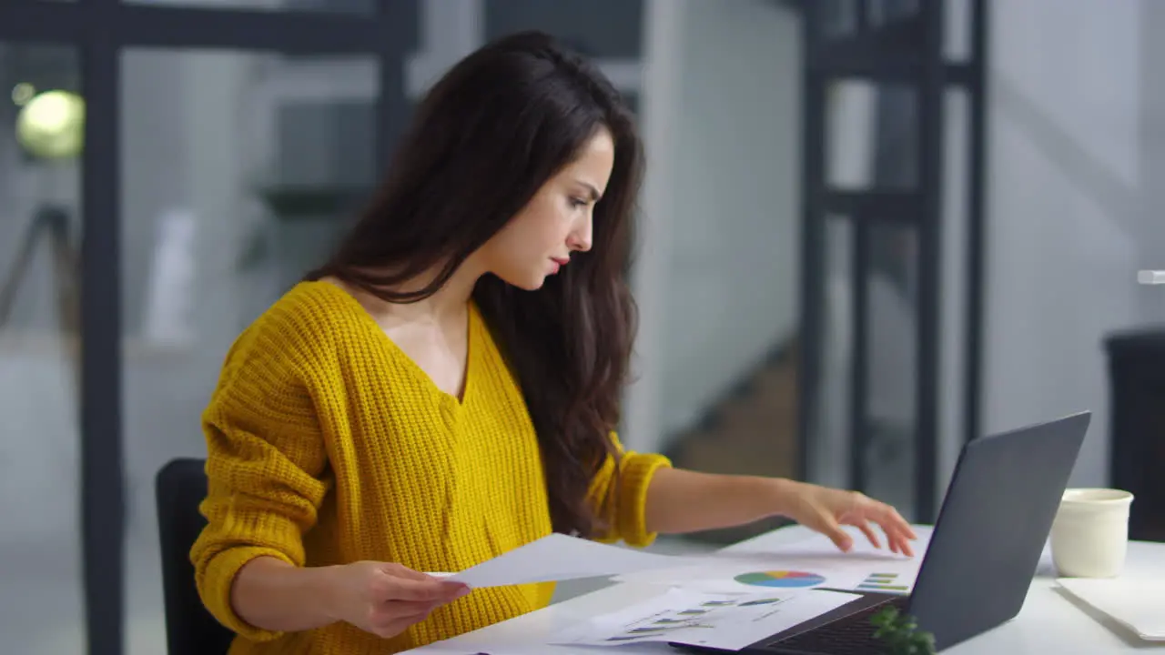 Close up focused business woman reading documents Serious girl checking data