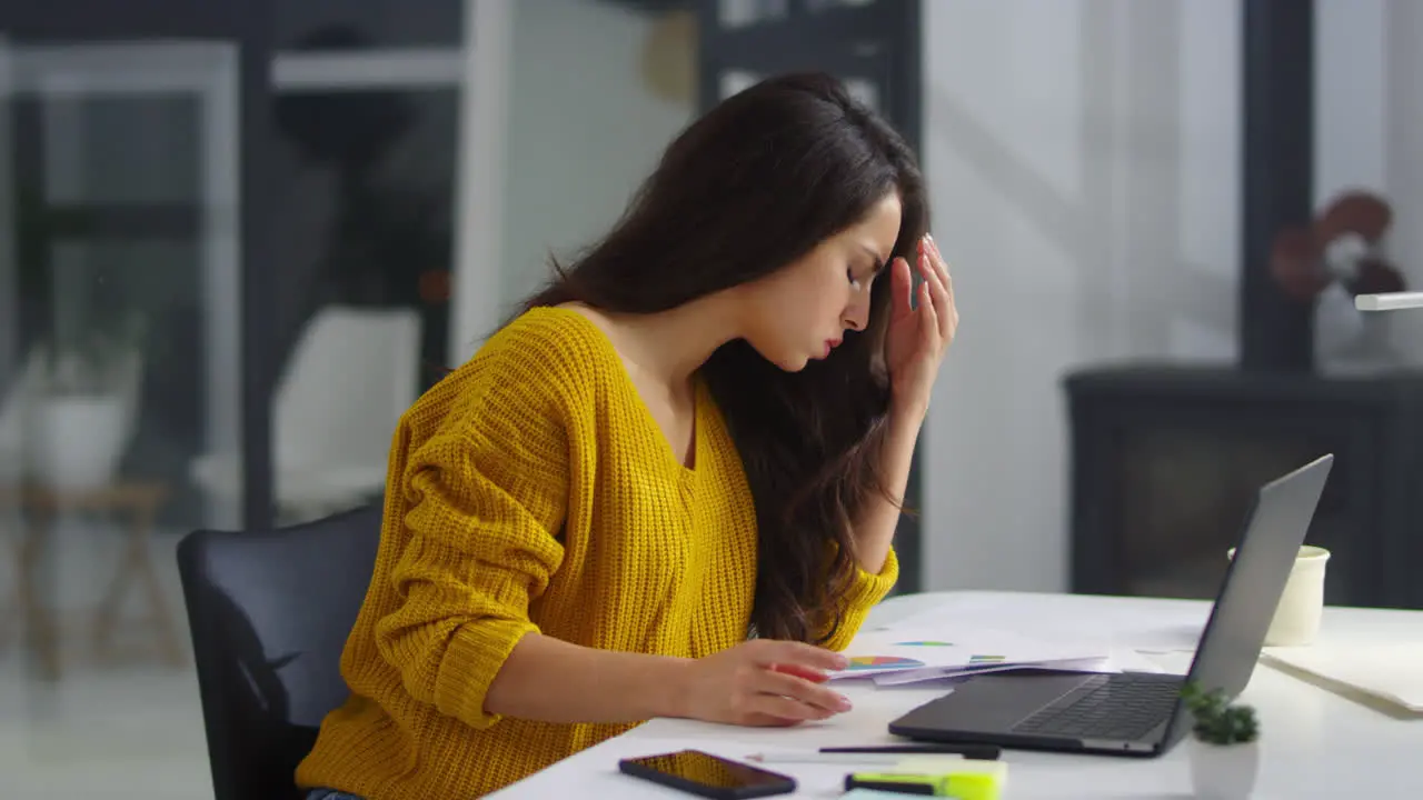 Close up upset business woman reading documents in office