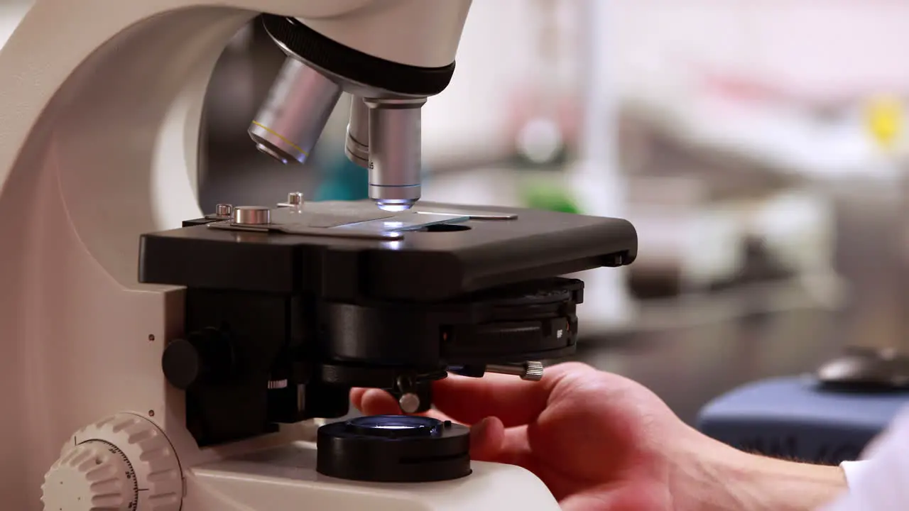 Scientist preparing a microscope