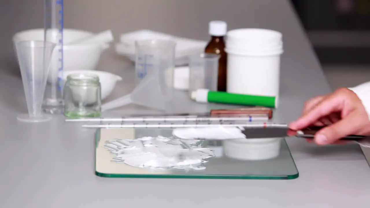 Scientist preparing a white paste